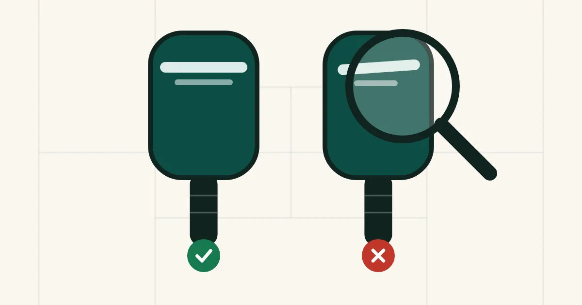 Two paddles side by side, one marked genuine and one under a magnifying glass marked fake